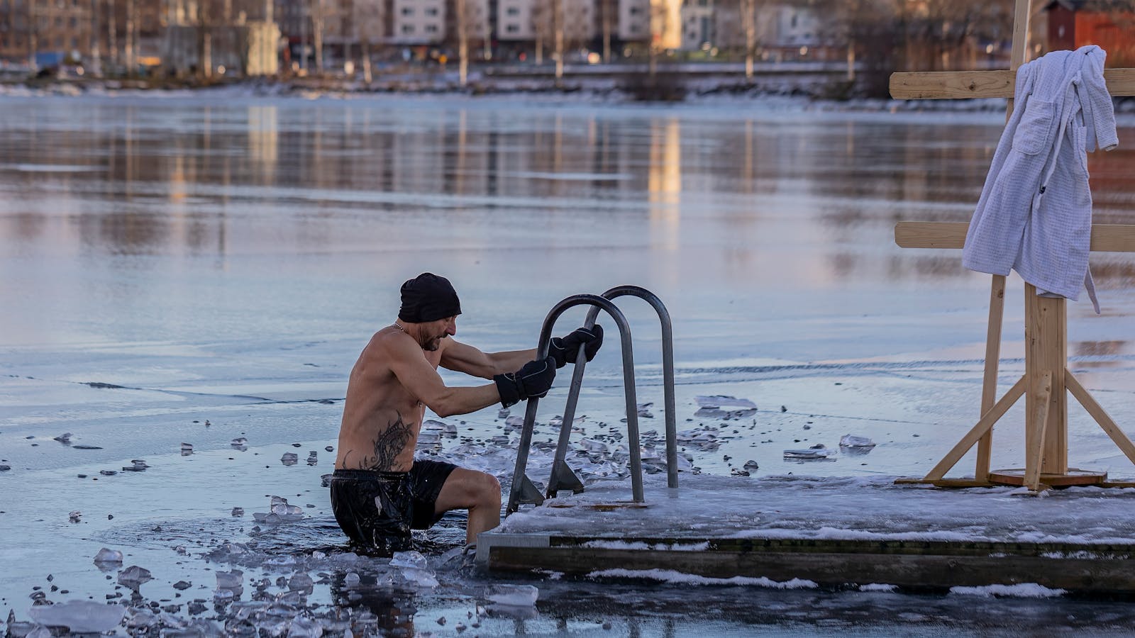 Shirtless person standing on a frozen lake in winter
