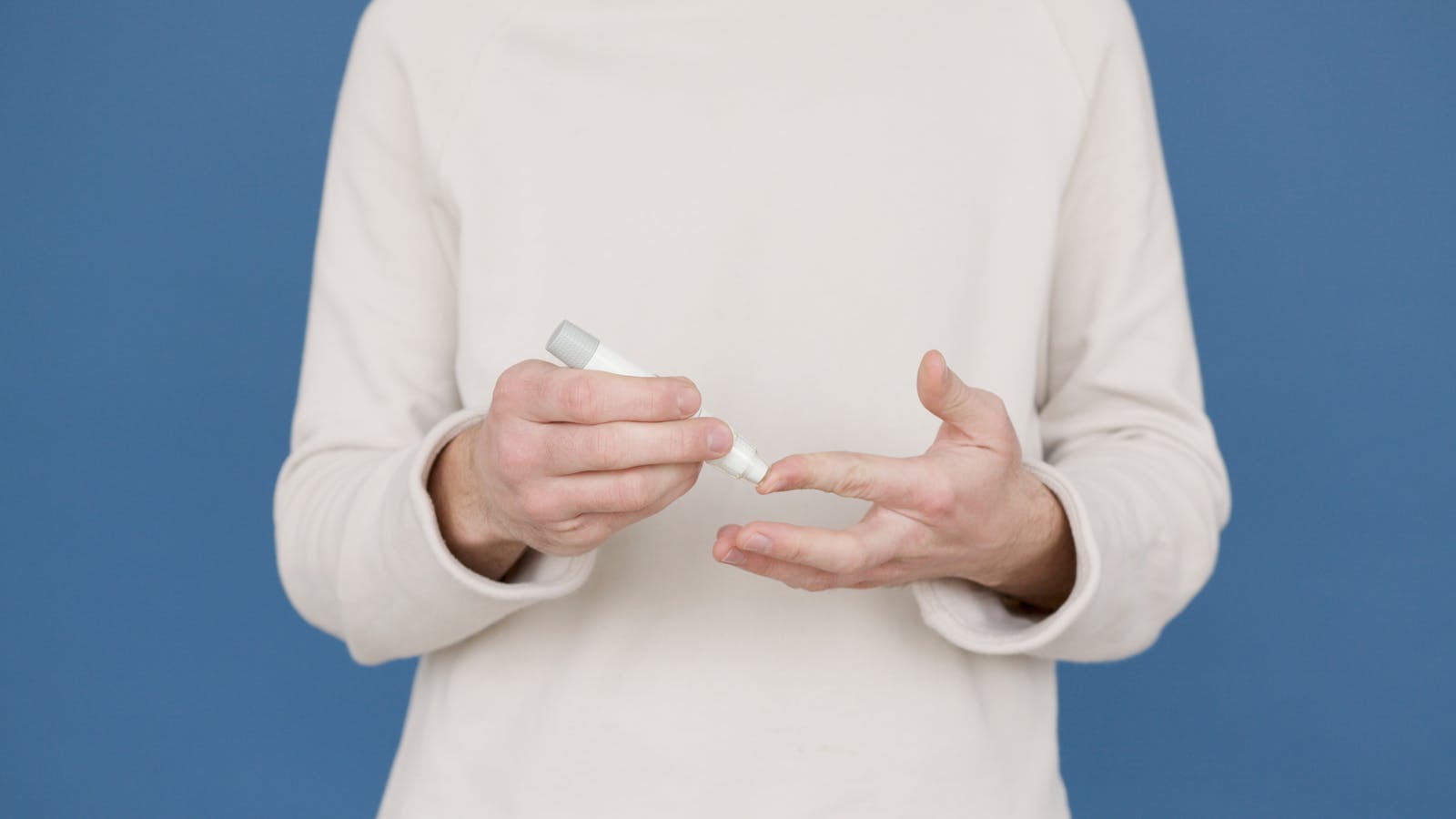 Person self-injecting medication with a pen-style injector
