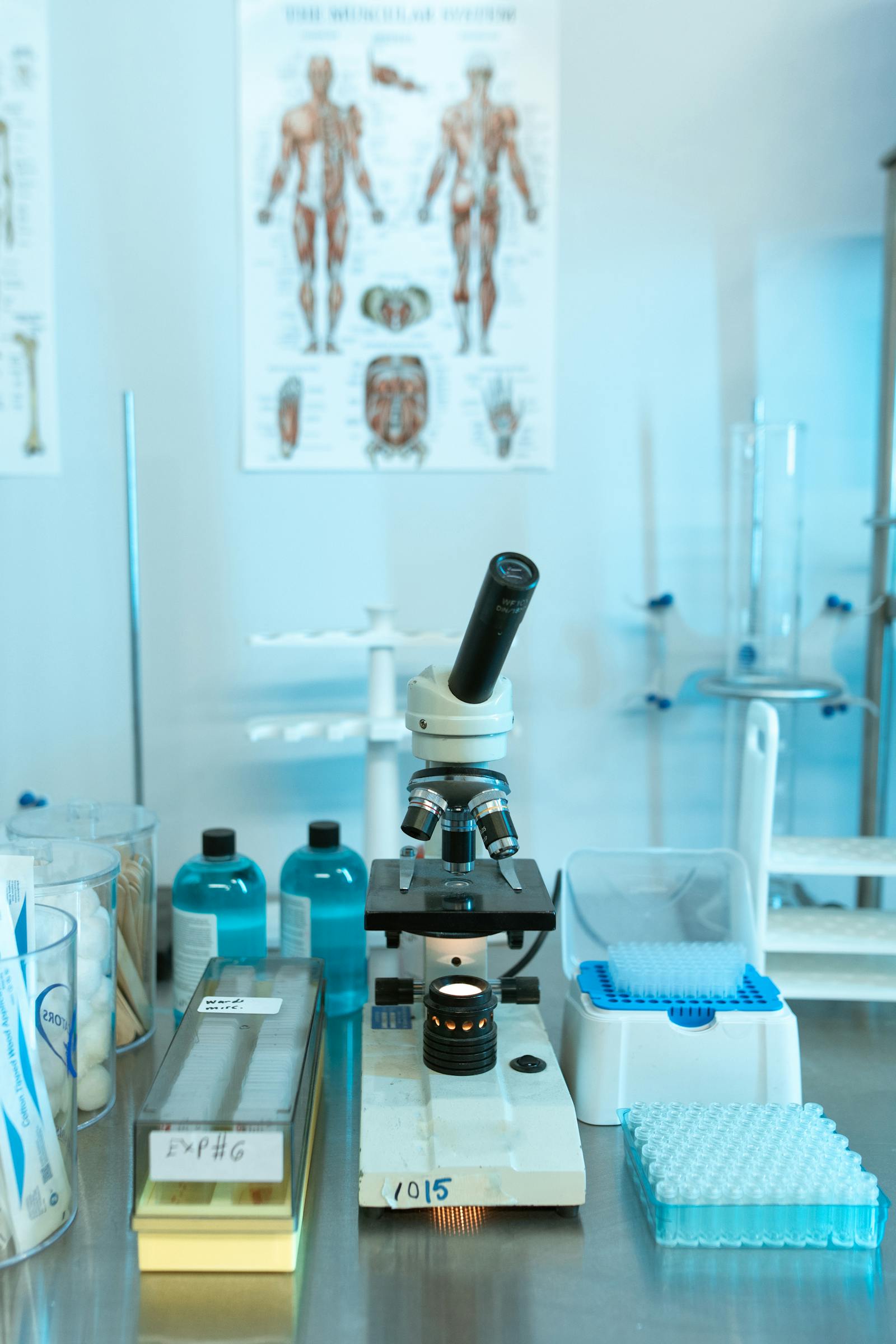 Laboratory benchtop with a microscope and assorted scientific apparatus
