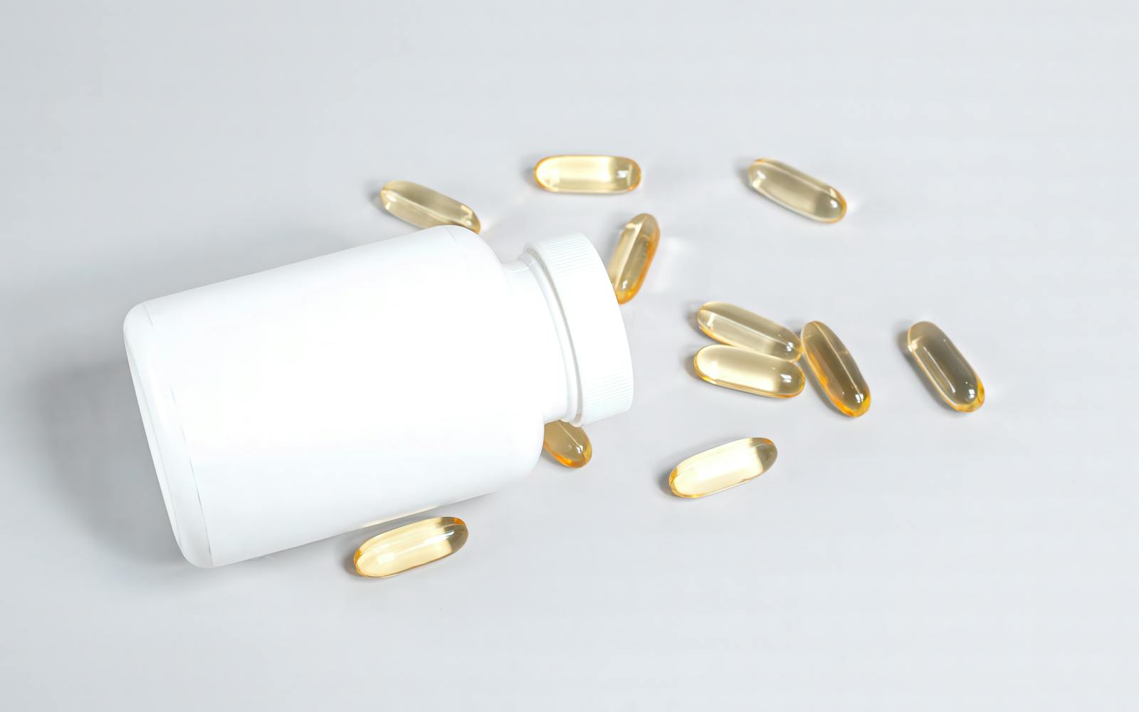 Close-up of golden amber omega-3 softgel capsules