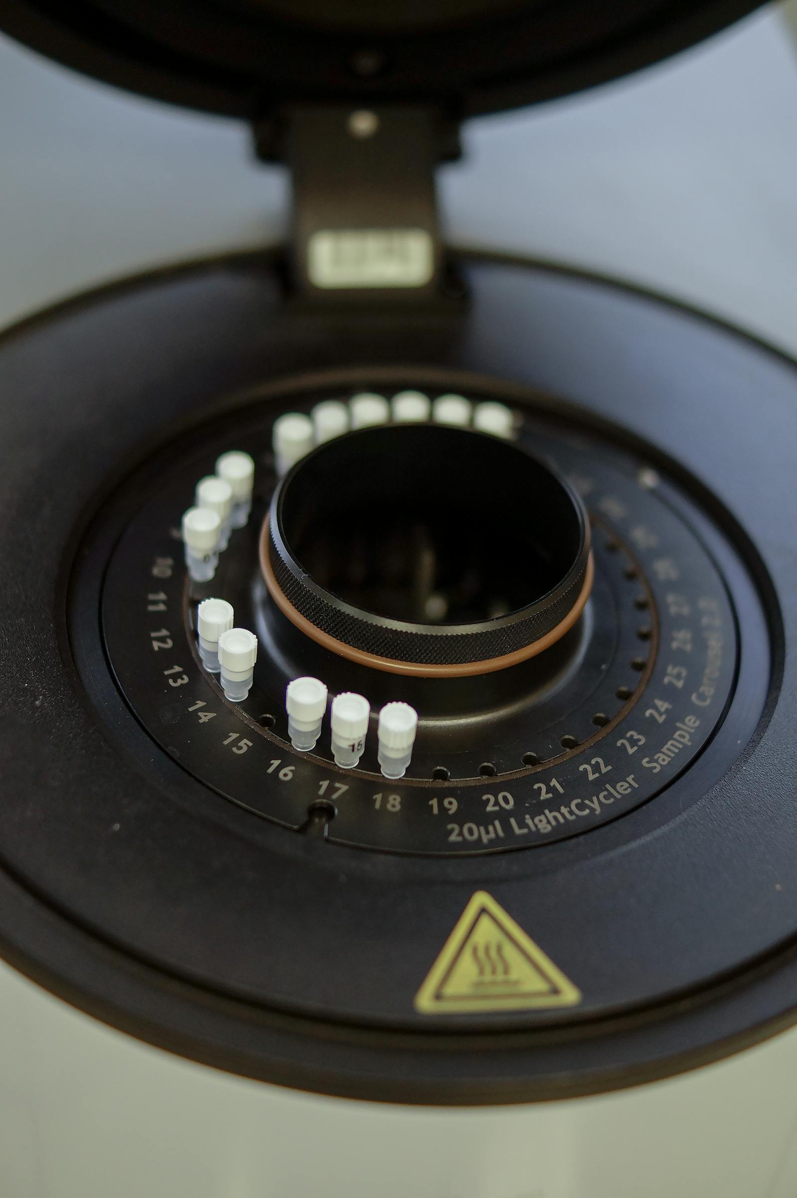 Close-up of a laboratory PCR thermocycler chamber used in genetic testing