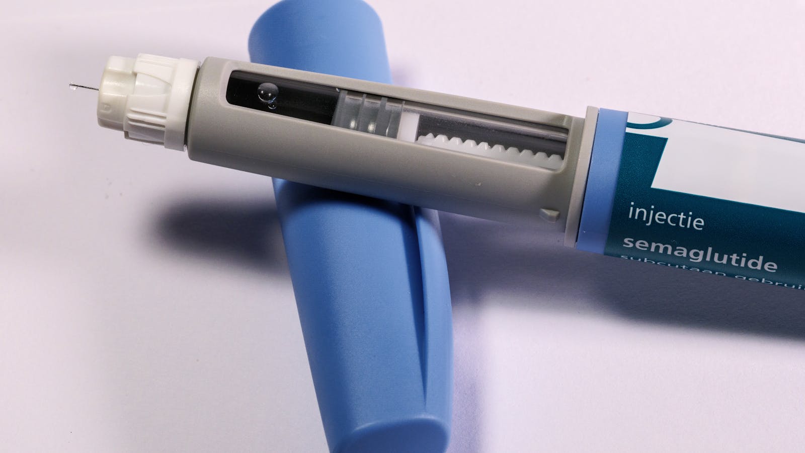 Close-up of a semaglutide injection pen on a flat surface