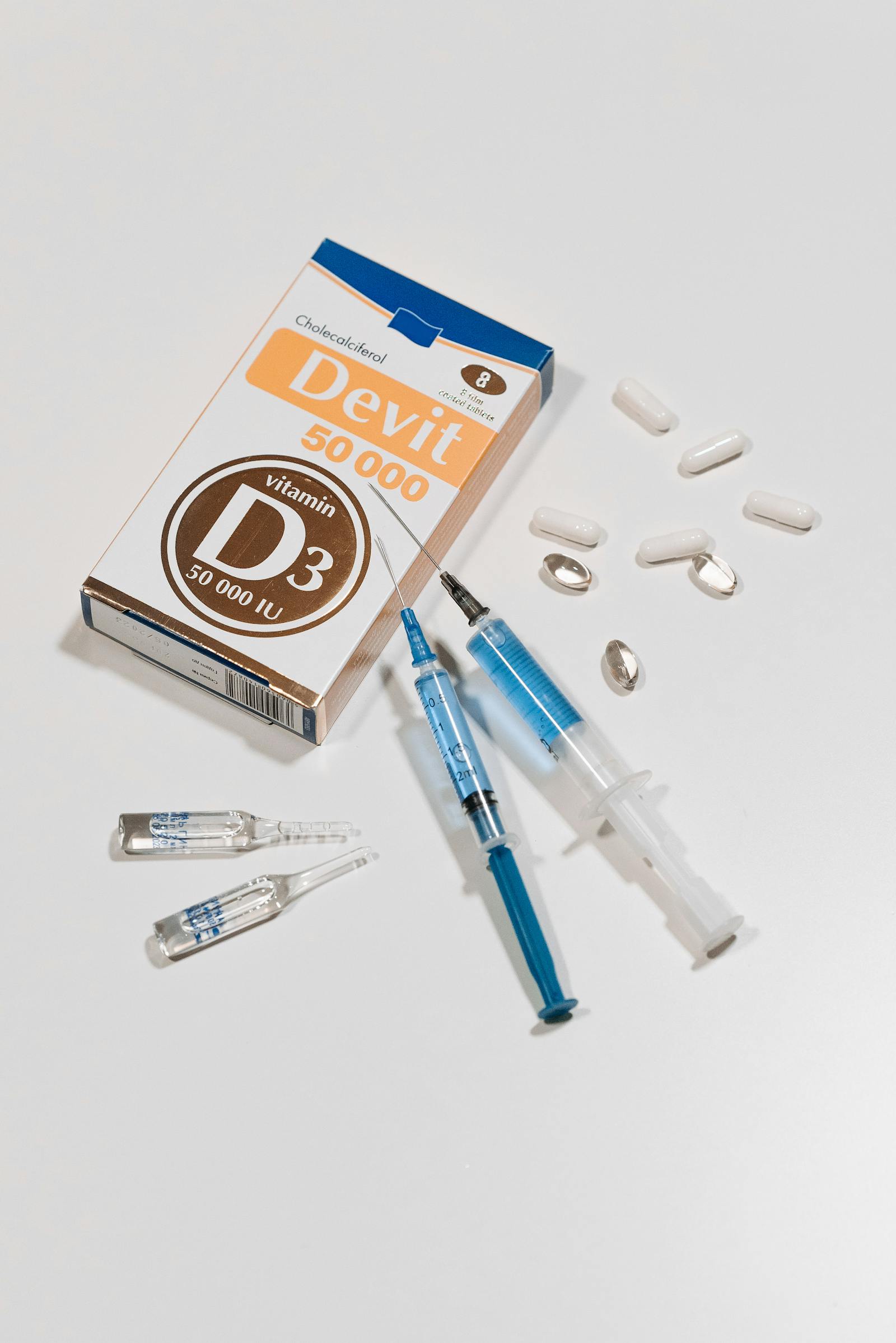 Vitamin D supplement softgel capsules on a clean surface