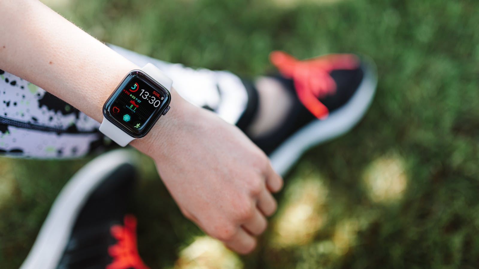 Smartwatch on a wrist displaying health metrics